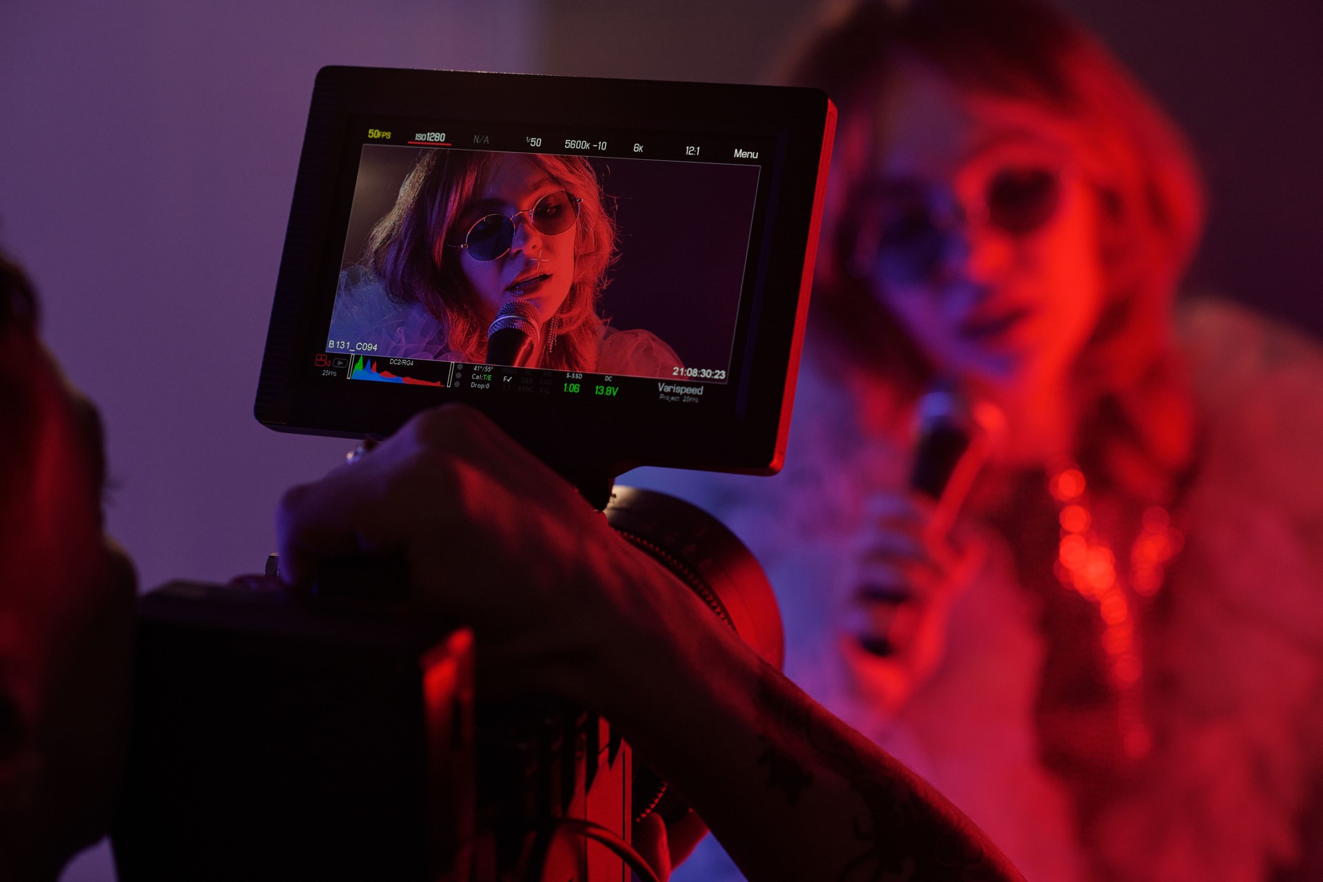 Filming Monitor Showing Woman with Microphone Singing